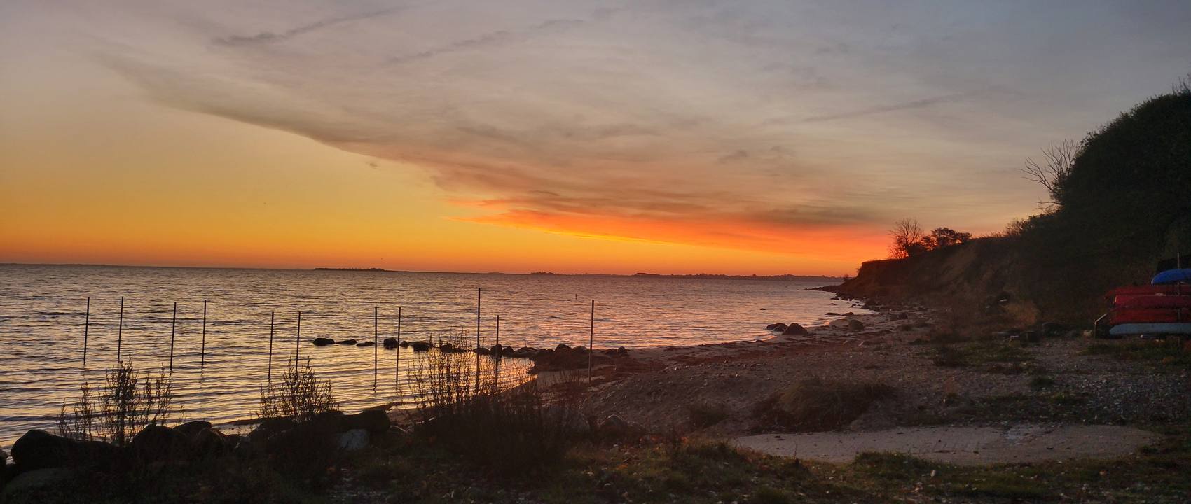 Ember-coloured dawn over the water on Ærø